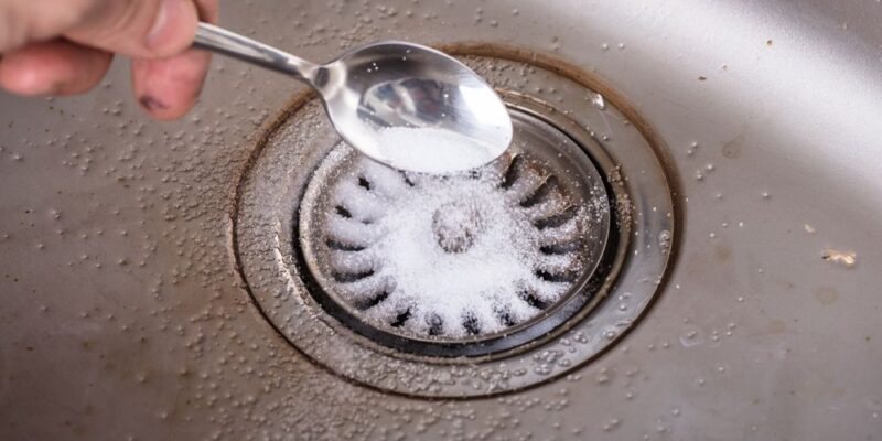 cleaning a drain with baking soda