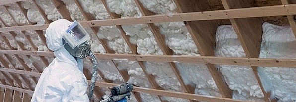 spray foam insulation being installed in a roof